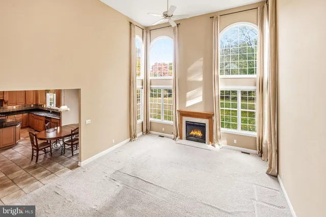 an empty room with furniture and a fireplace