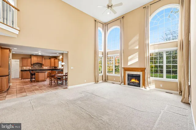 a view of livingroom with furniture fire place and a window