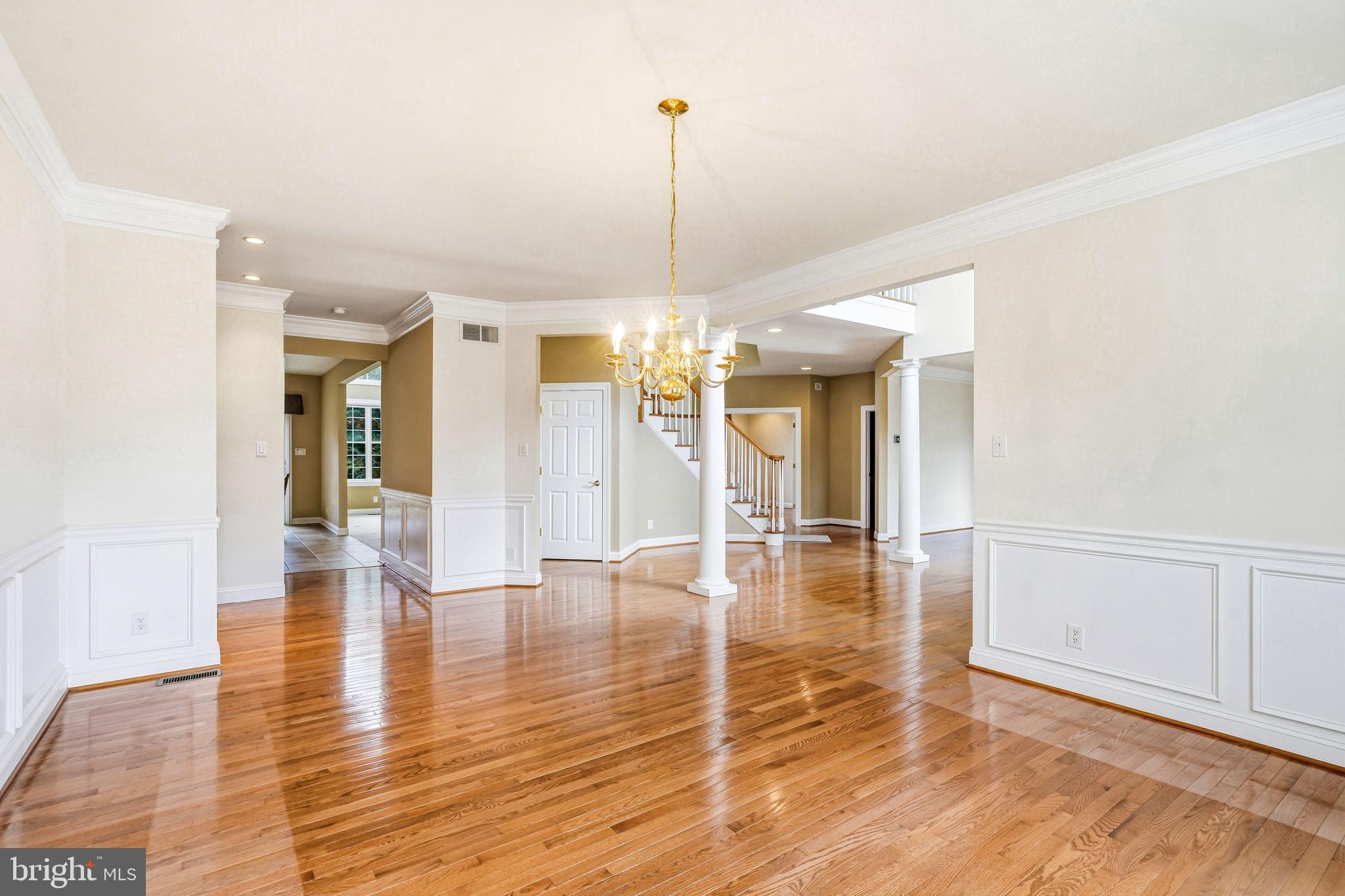 950 Borton Landing Road Moorestown, NJ 08057 - Photo 19 of 53 a view of a room with wooden floor staircase and kitchen view