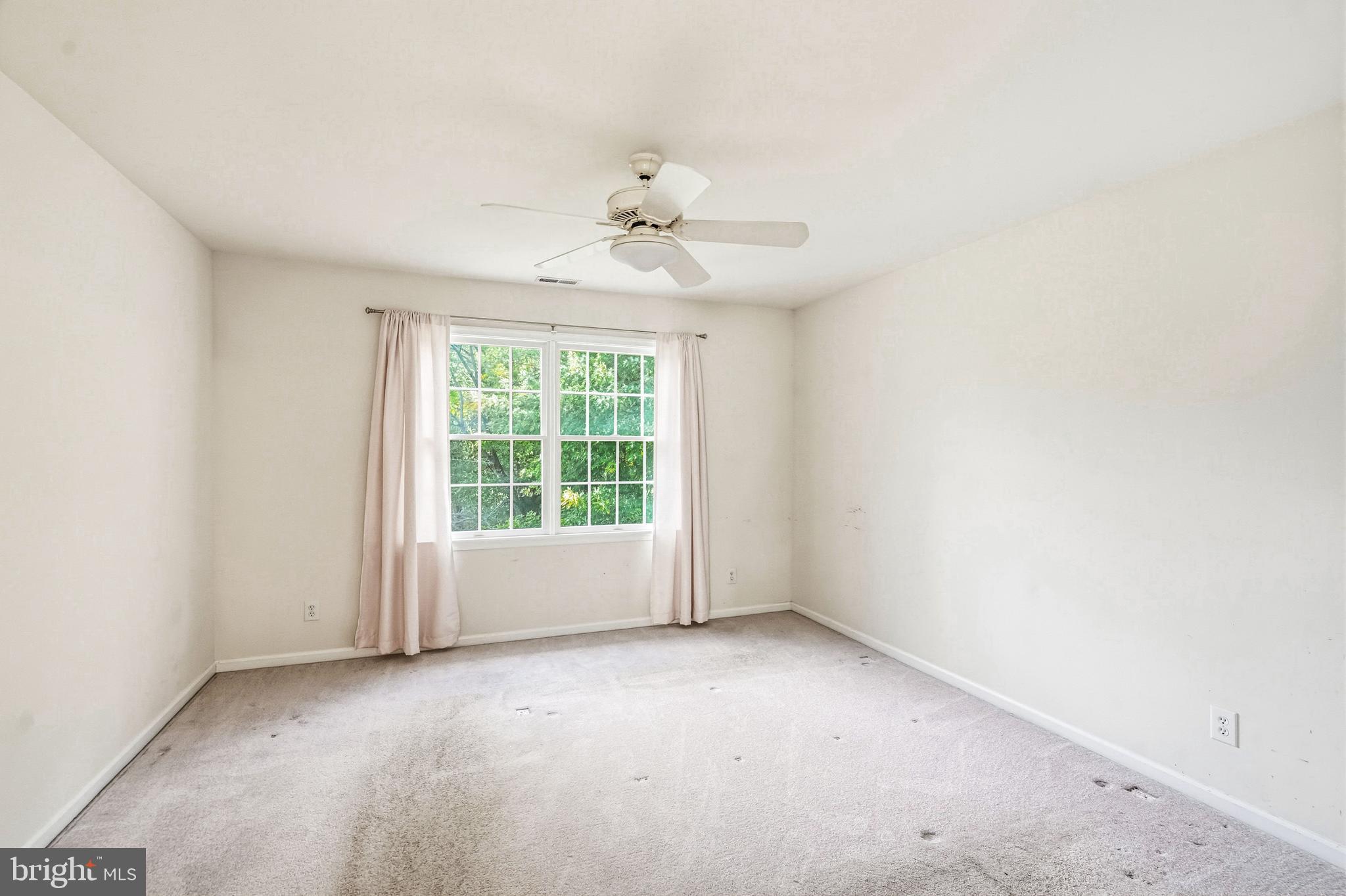 950 Borton Landing Road Moorestown, NJ 08057 - Photo 30 of 53 an empty room with a window and a ceiling fan