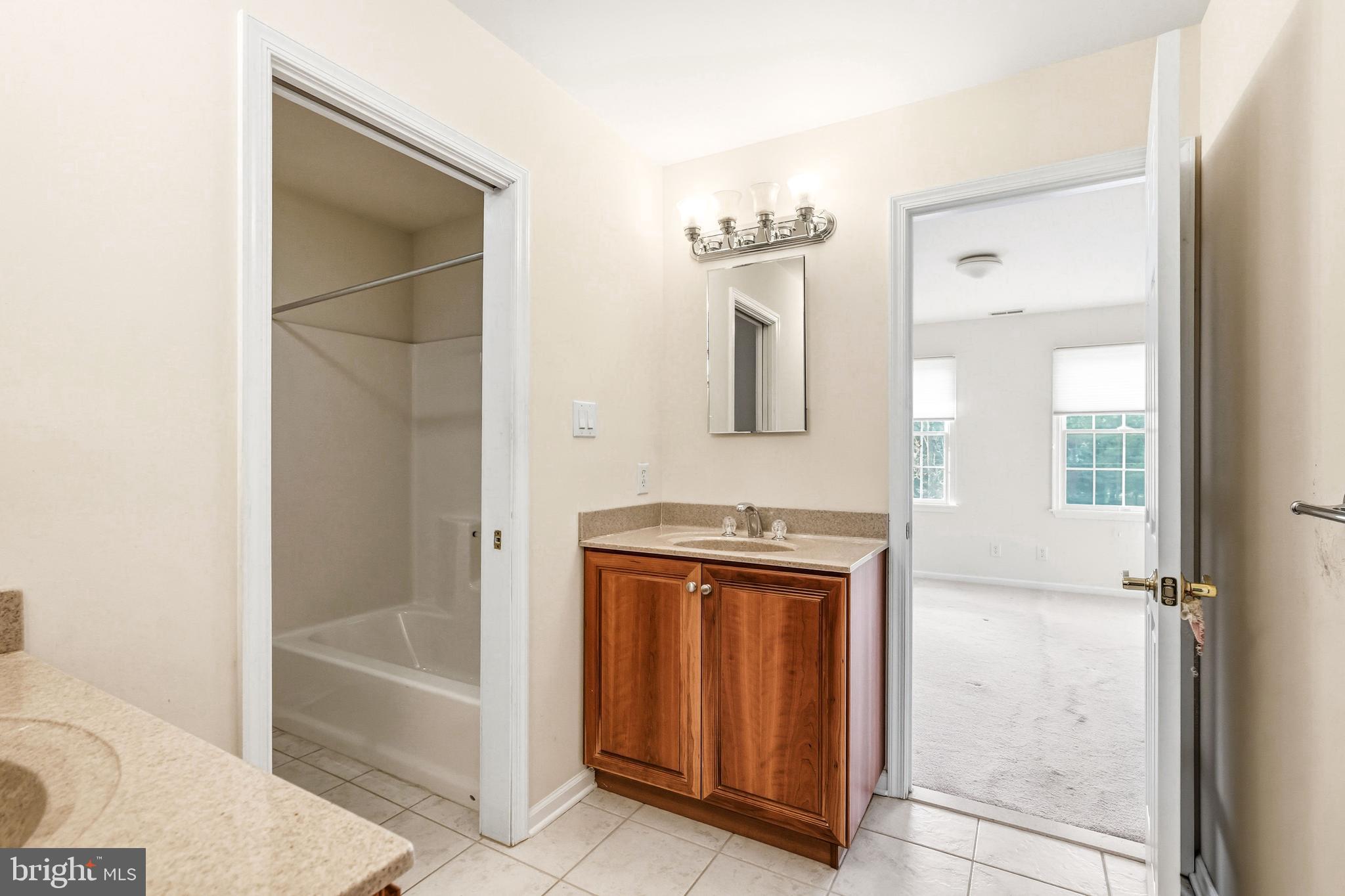 950 Borton Landing Road Moorestown, NJ 08057 - Photo 32 of 53 a bathroom with a sink a mirror and a bathtub