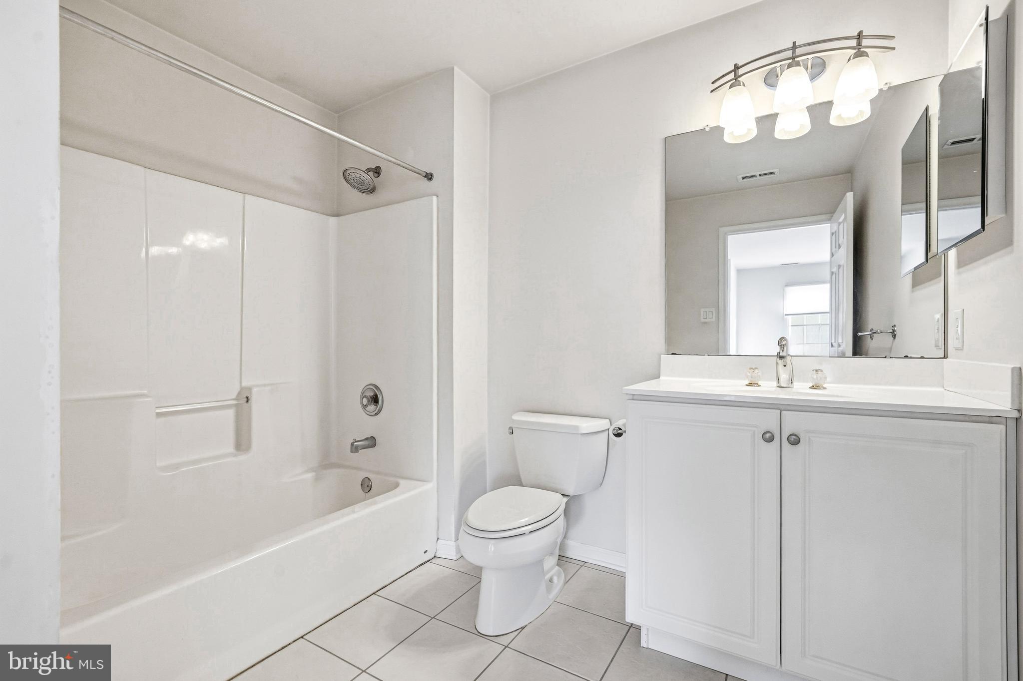 950 Borton Landing Road Moorestown, NJ 08057 - Photo 34 of 53 a bathroom with a toilet a sink a mirror a bathtub and vanity