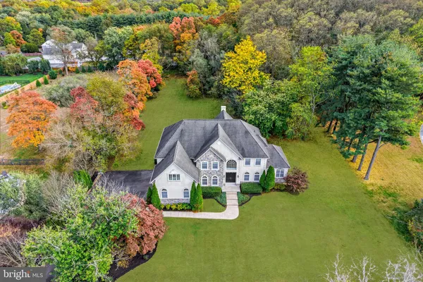 an aerial view of a houses with yard