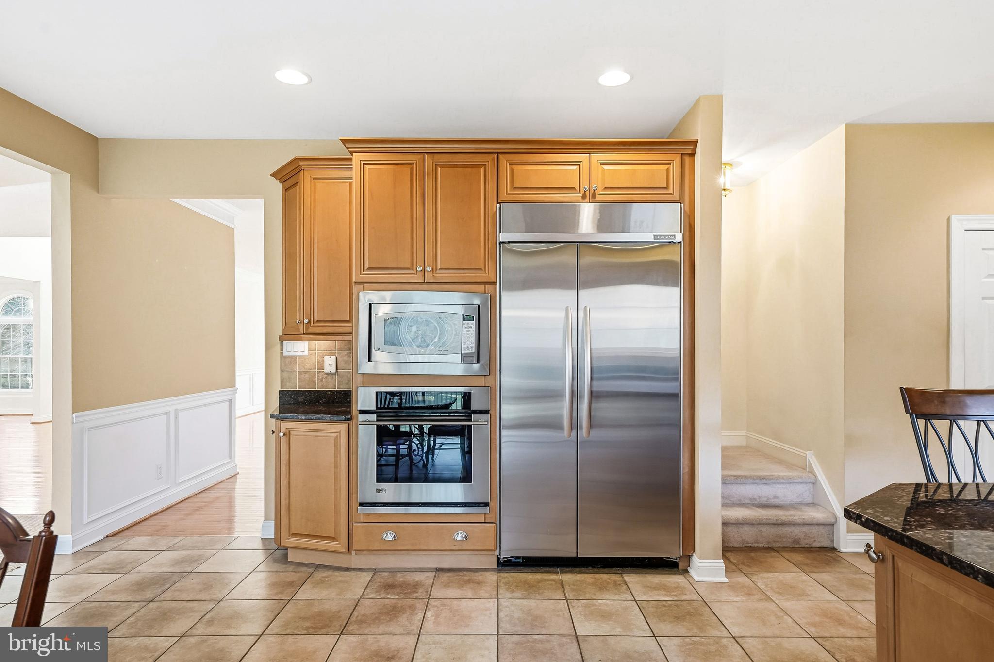 950 Borton Landing Road Moorestown, NJ 08057 - Photo 10 of 53 a kitchen with stainless steel appliances granite countertop a refrigerator and a stove