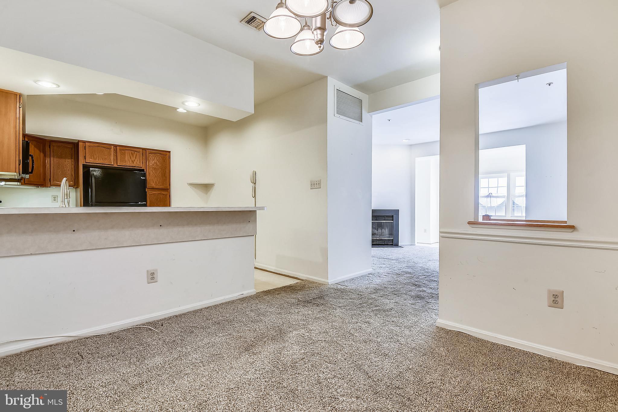 2704 Summerview Way, Unit 103 Annapolis, MD 21401 - Photo 14 of 41 Dining Room into Kitchen
