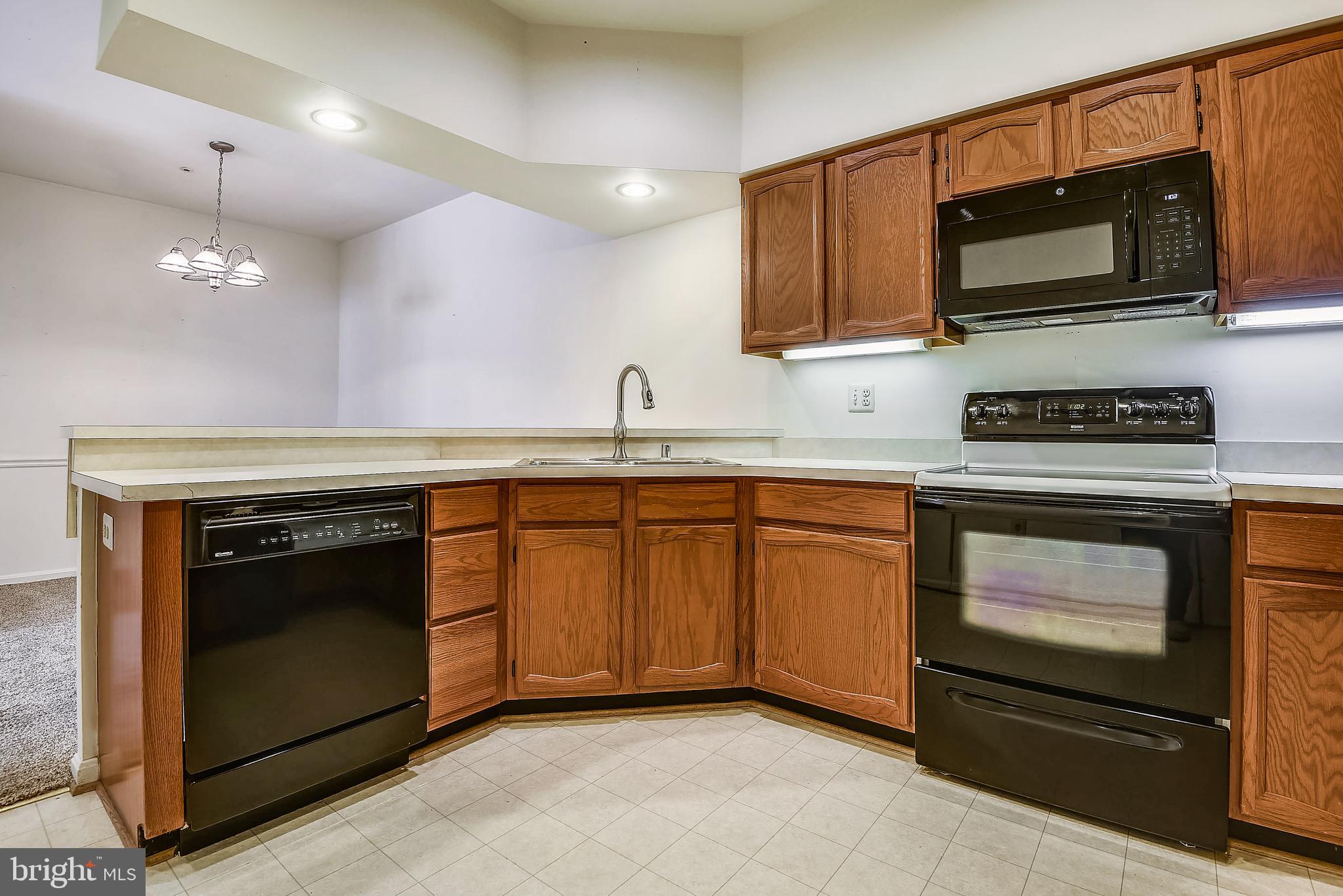 2704 Summerview Way, Unit 103 Annapolis, MD 21401 - Photo 16 of 41 Kitchen into Dining Room