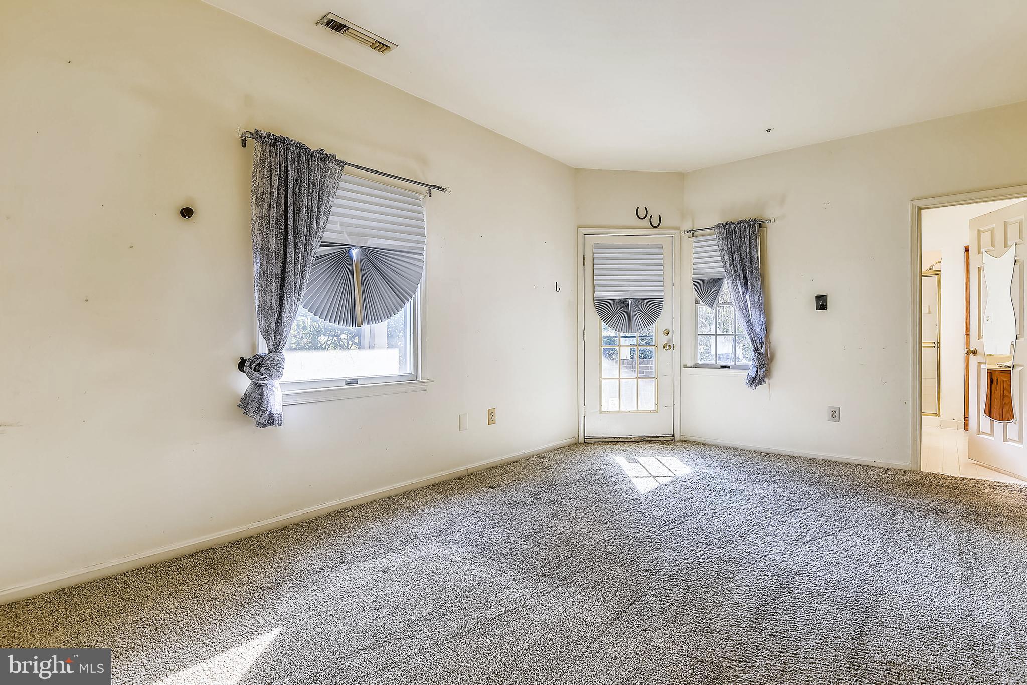 2704 Summerview Way, Unit 103 Annapolis, MD 21401 - Photo 19 of 41 Spacious Master Bedroom with Door to Patio
