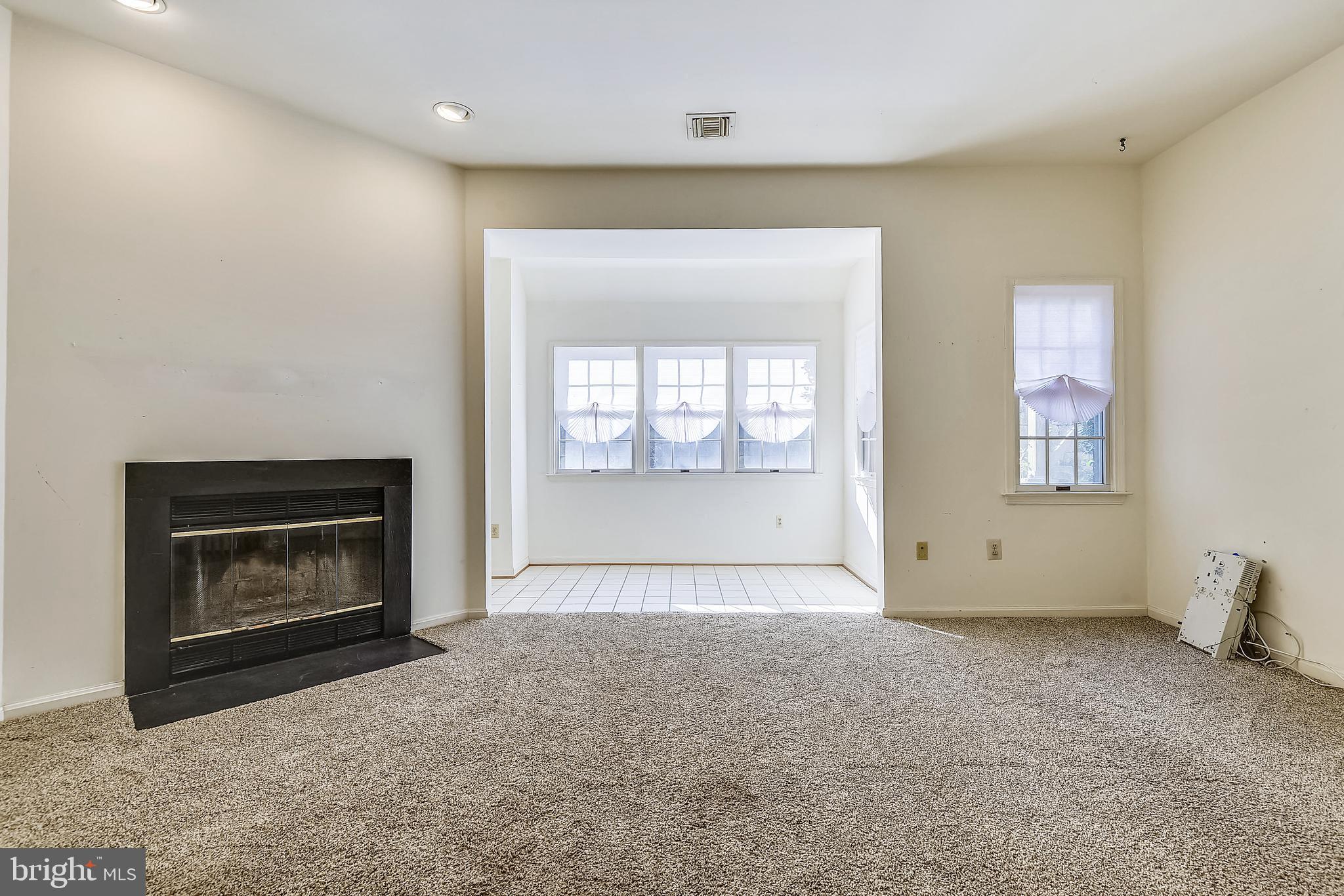 2704 Summerview Way, Unit 103 Annapolis, MD 21401 - Photo 5 of 41 Living Room Opens to Sun Room