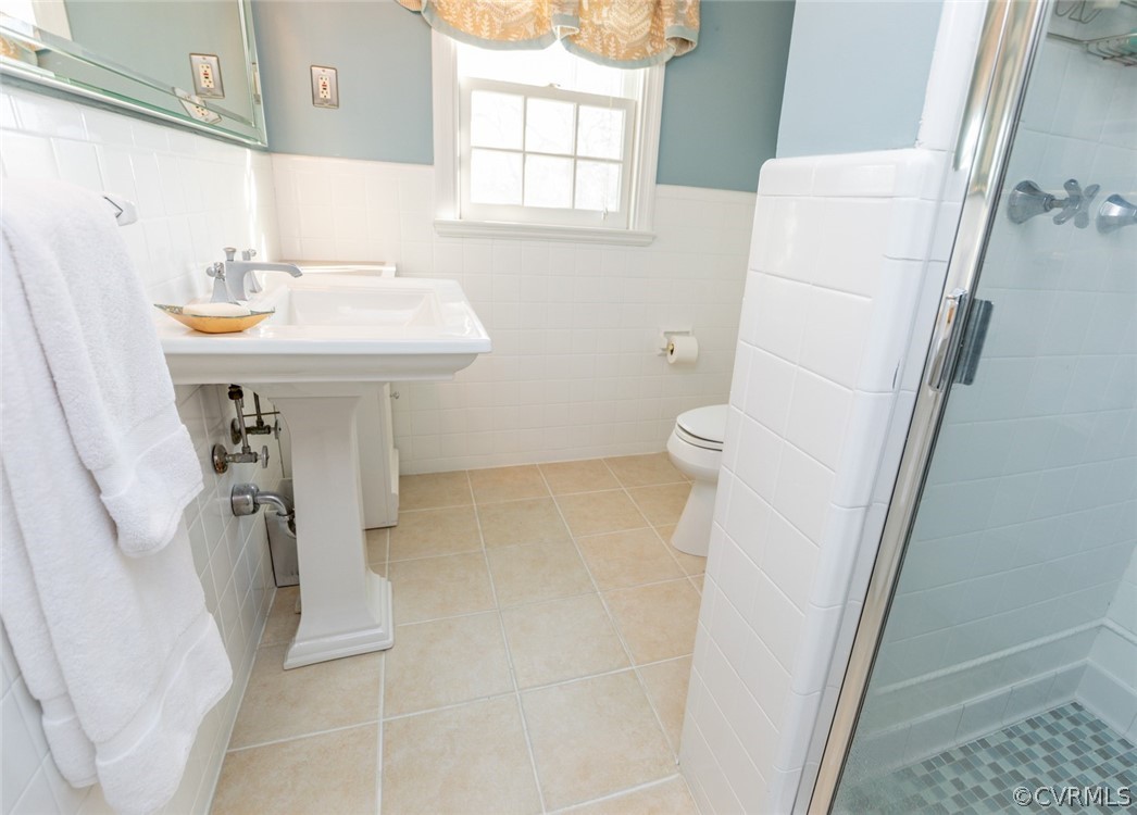 227 Gun Club Road Richmond, VA 23221 - Photo 29 of 34 The master bathroom has tile floors, pedestal sink
