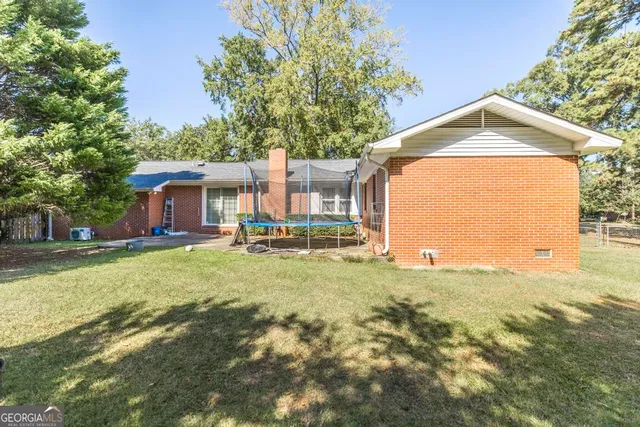 a backyard of a house with lots of green space