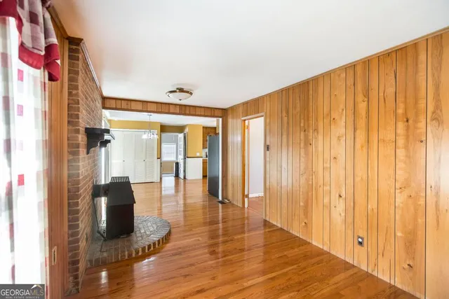 a view of front door and porch with wooden floor