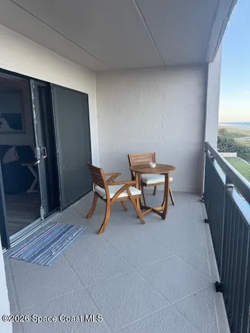 a room with furniture and air conditioner vent