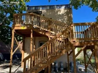a view of street along with deck and outdoor seating