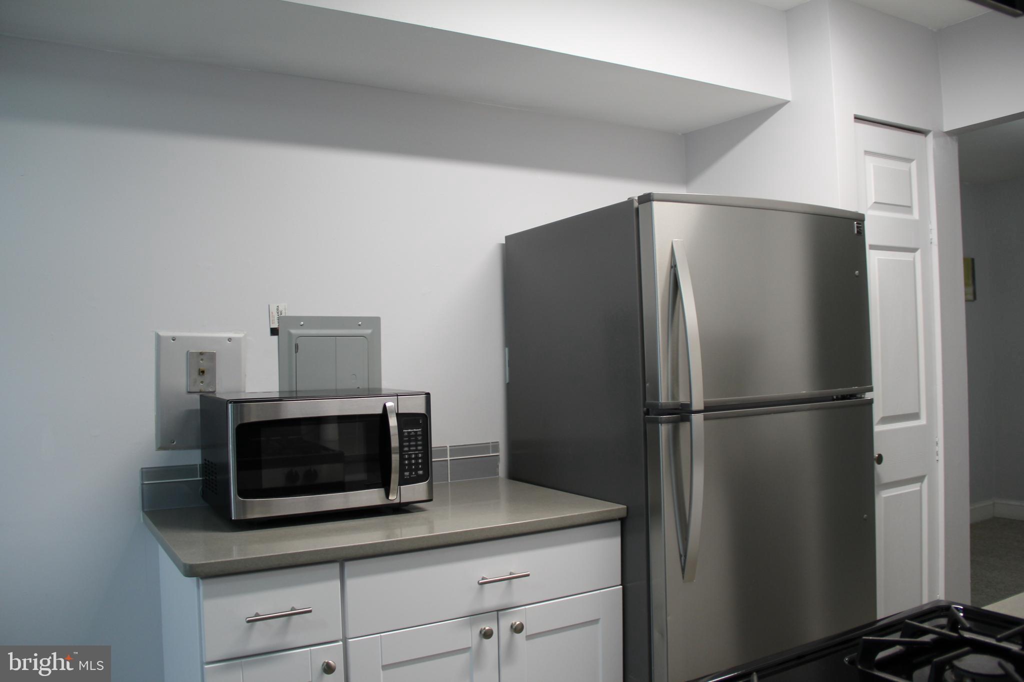 3360 Woodburn Road, Unit 23 Annandale, VA 22003 - Photo 12 of 50 a metallic refrigerator freezer sitting in a kitchen