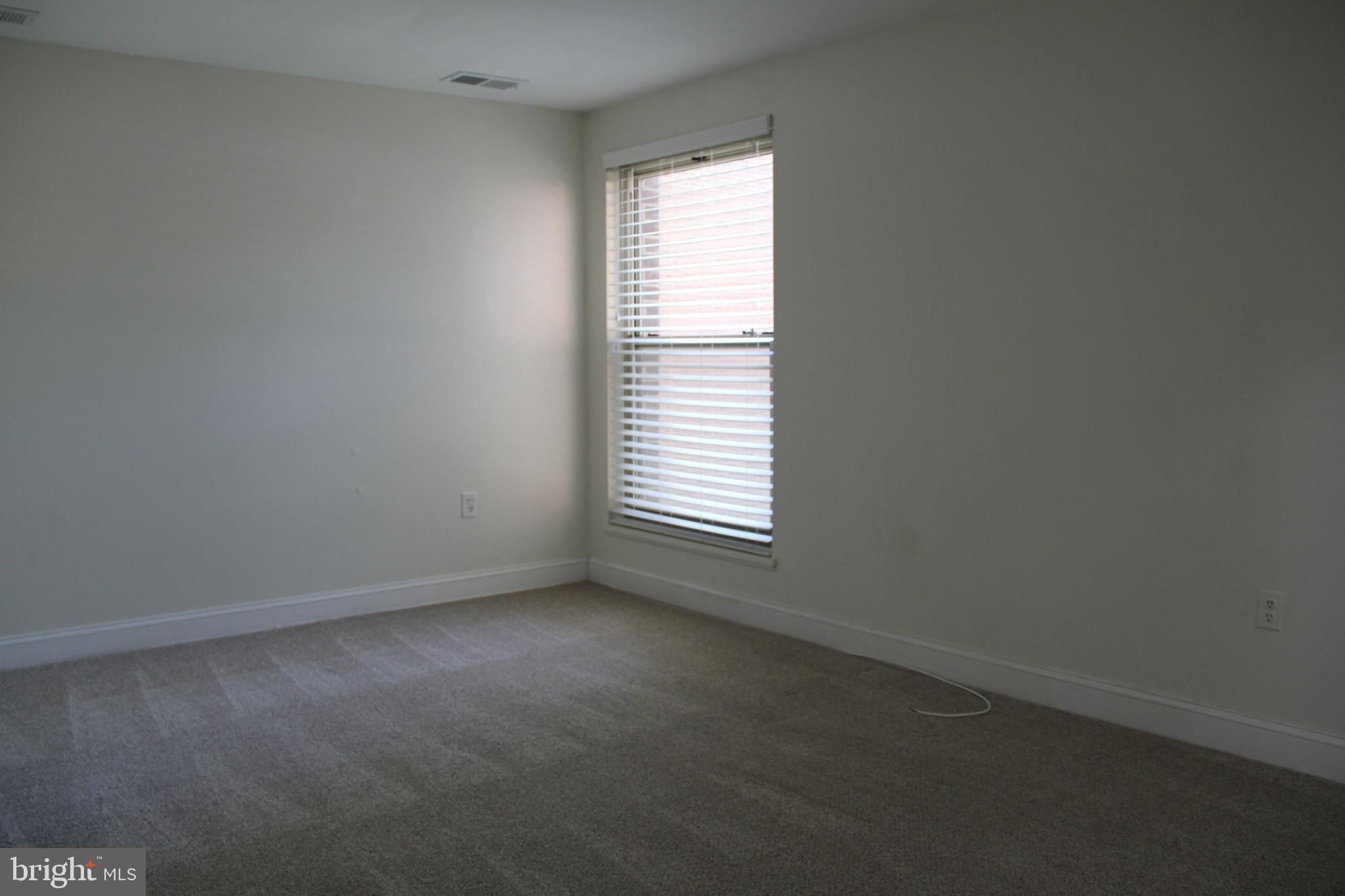 3360 Woodburn Road, Unit 23 Annandale, VA 22003 - Photo 19 of 50 an empty room with a window