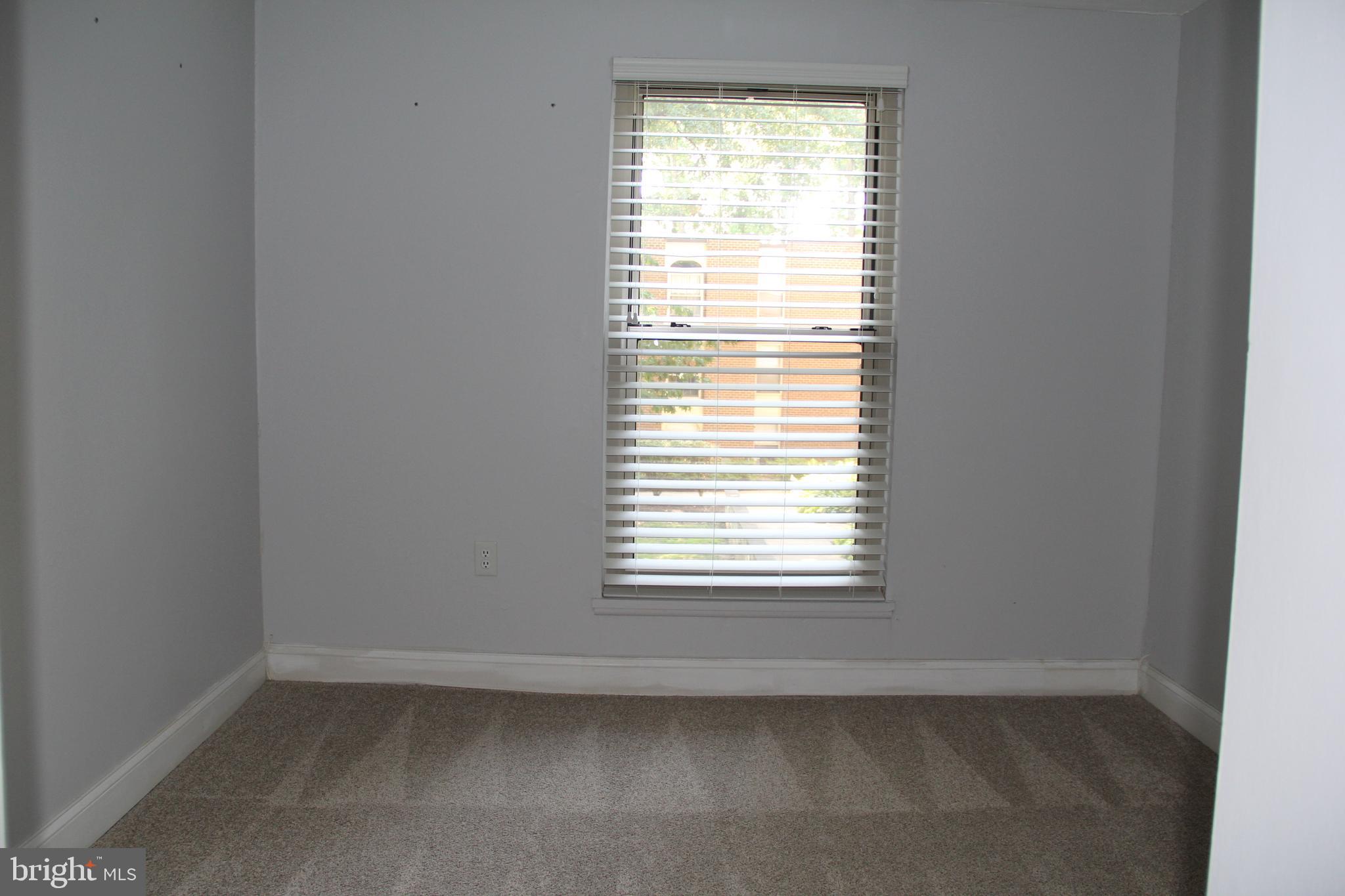 3360 Woodburn Road, Unit 23 Annandale, VA 22003 - Photo 20 of 50 an empty room with a window