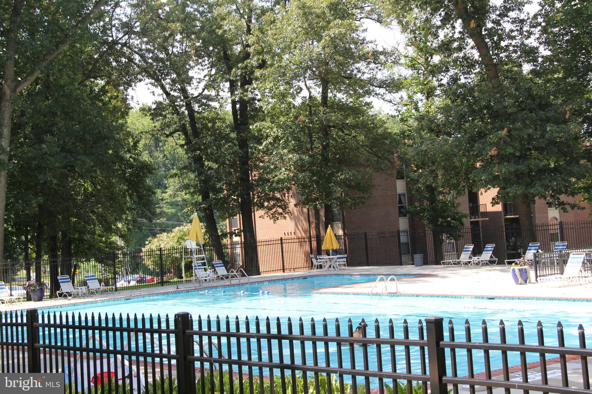 3360 Woodburn Road, Unit 23 Annandale, VA 22003 - Photo 46 of 50 a view of a house with a snow in the yard