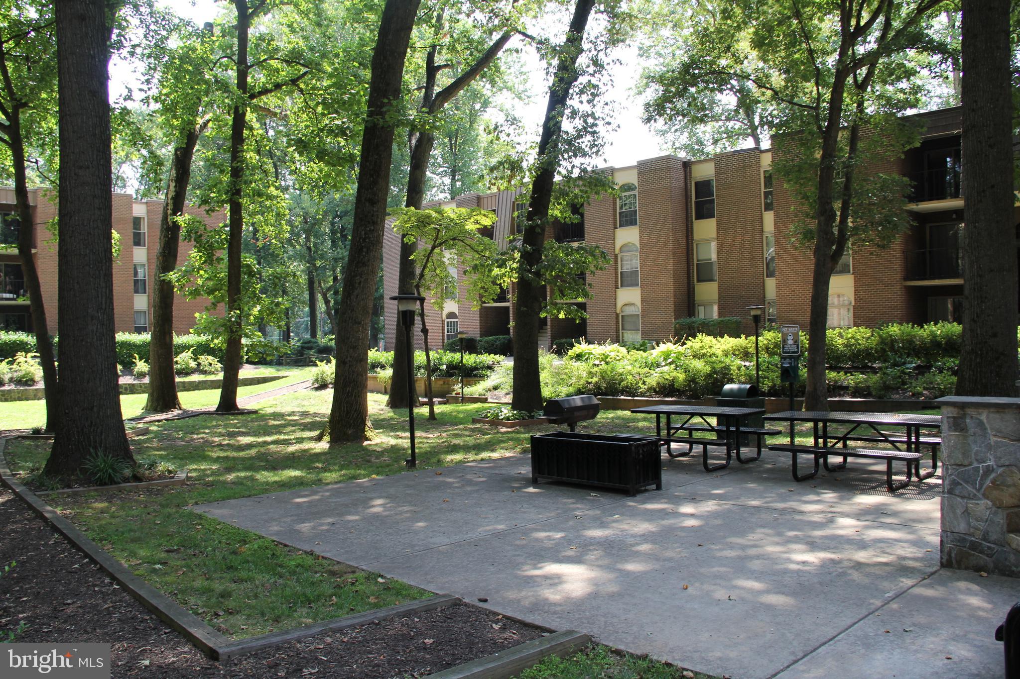 3360 Woodburn Road, Unit 23 Annandale, VA 22003 - Photo 50 of 50 a view of a chairs and table in the garden