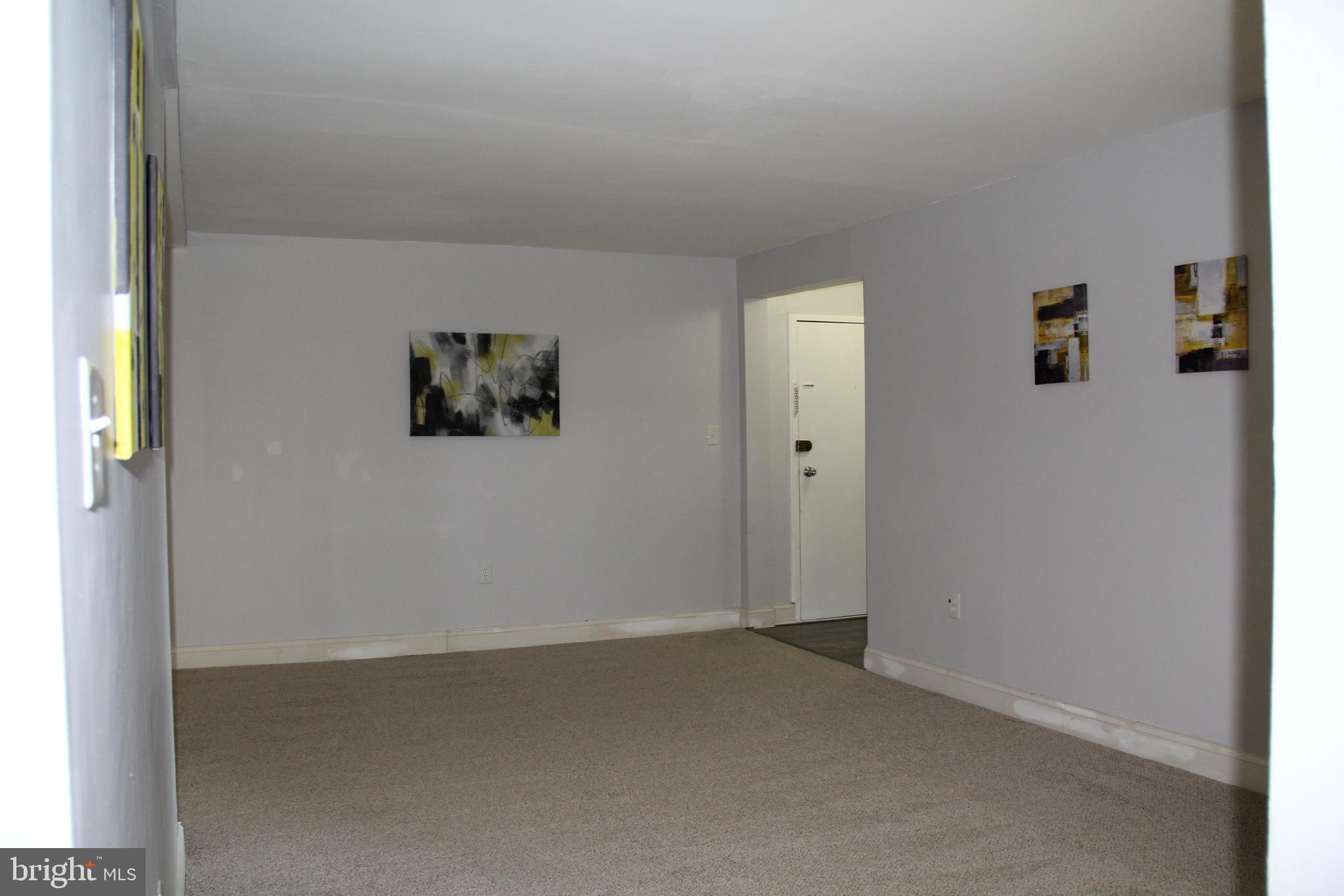 3360 Woodburn Road, Unit 23 Annandale, VA 22003 - Photo 7 of 50 an empty room with windows