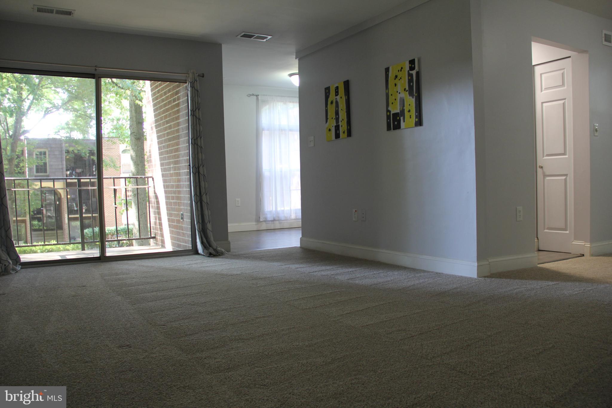 3360 Woodburn Road, Unit 23 Annandale, VA 22003 - Photo 8 of 50 a view of empty room with floor to ceiling window