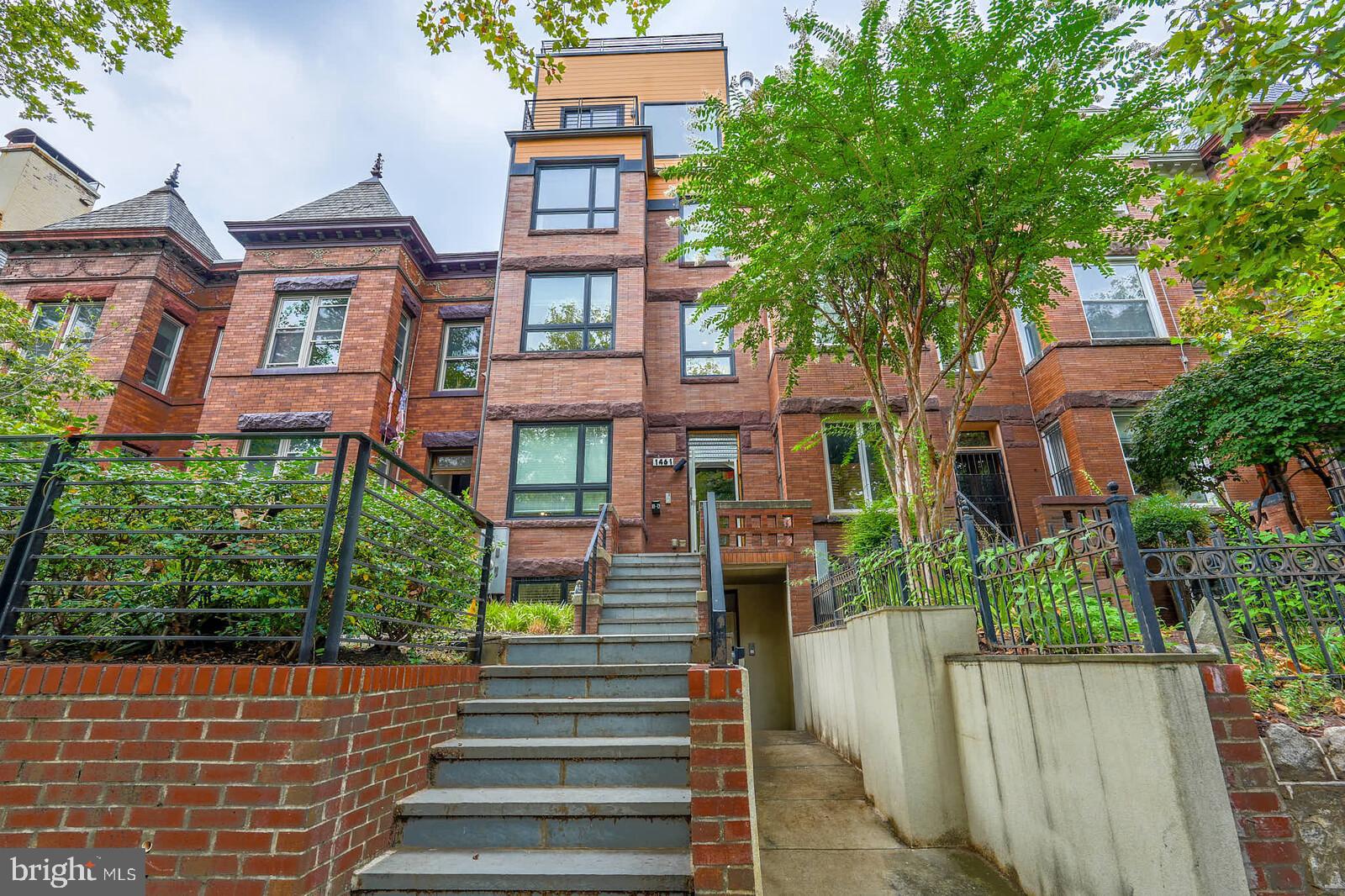 1461 Chapin Street Northwest Washington, DC 20009 - Photo 67 of 67 Charming brick facade with lush greenery.
