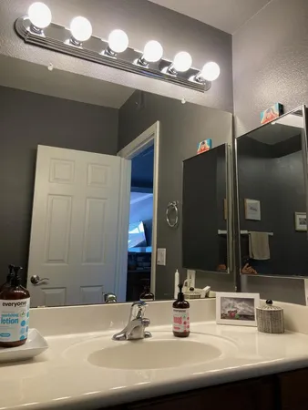 a bathroom with a sink and a mirror