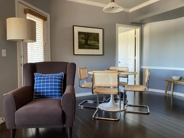 a room with furniture and wooden floor