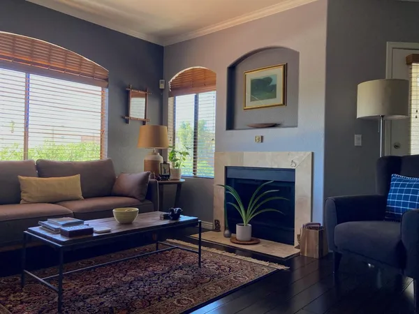 a living room with furniture and a fireplace
