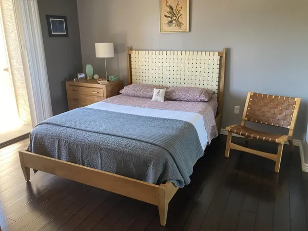 a bedroom with a bed and window