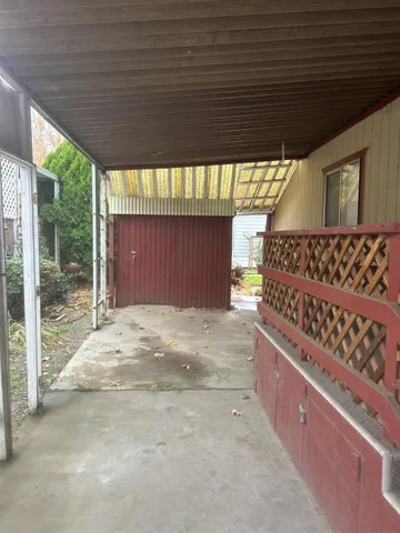 a view of a house with wooden fence