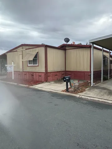 a view of walk in closet with wooden floor