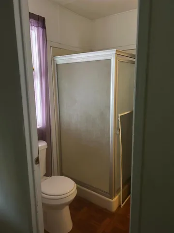a bathroom with a glass door shower