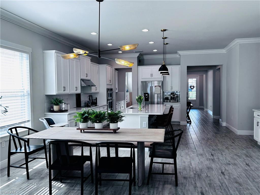 3444 Pilot Circle Naples, FL 34120 - Photo 13 of 13 a dining room with furniture and window