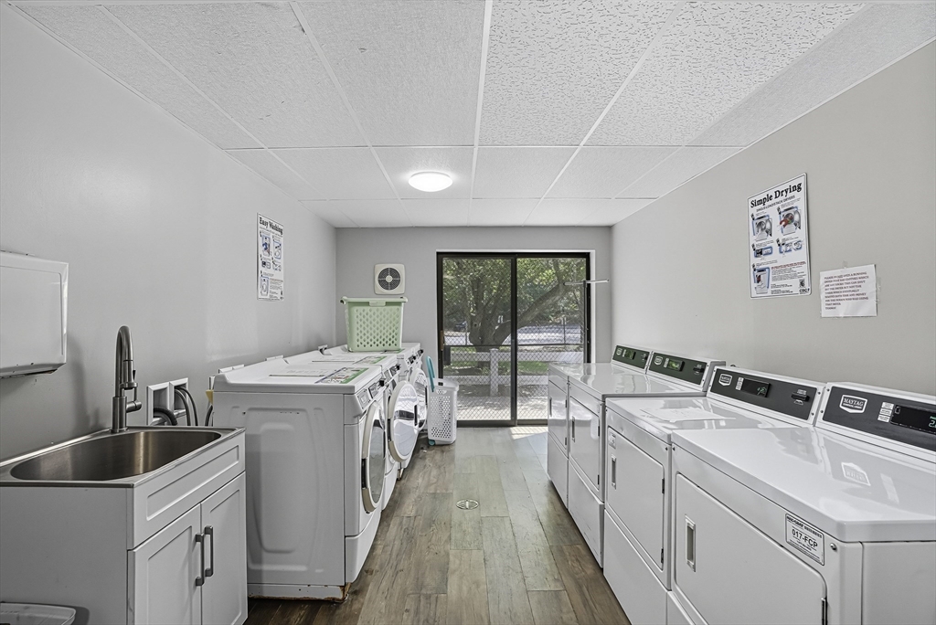 85 Commons Drive, Unit 210 Shrewsbury, MA 01545 - Photo 11 of 15 a kitchen that has a sink and large window