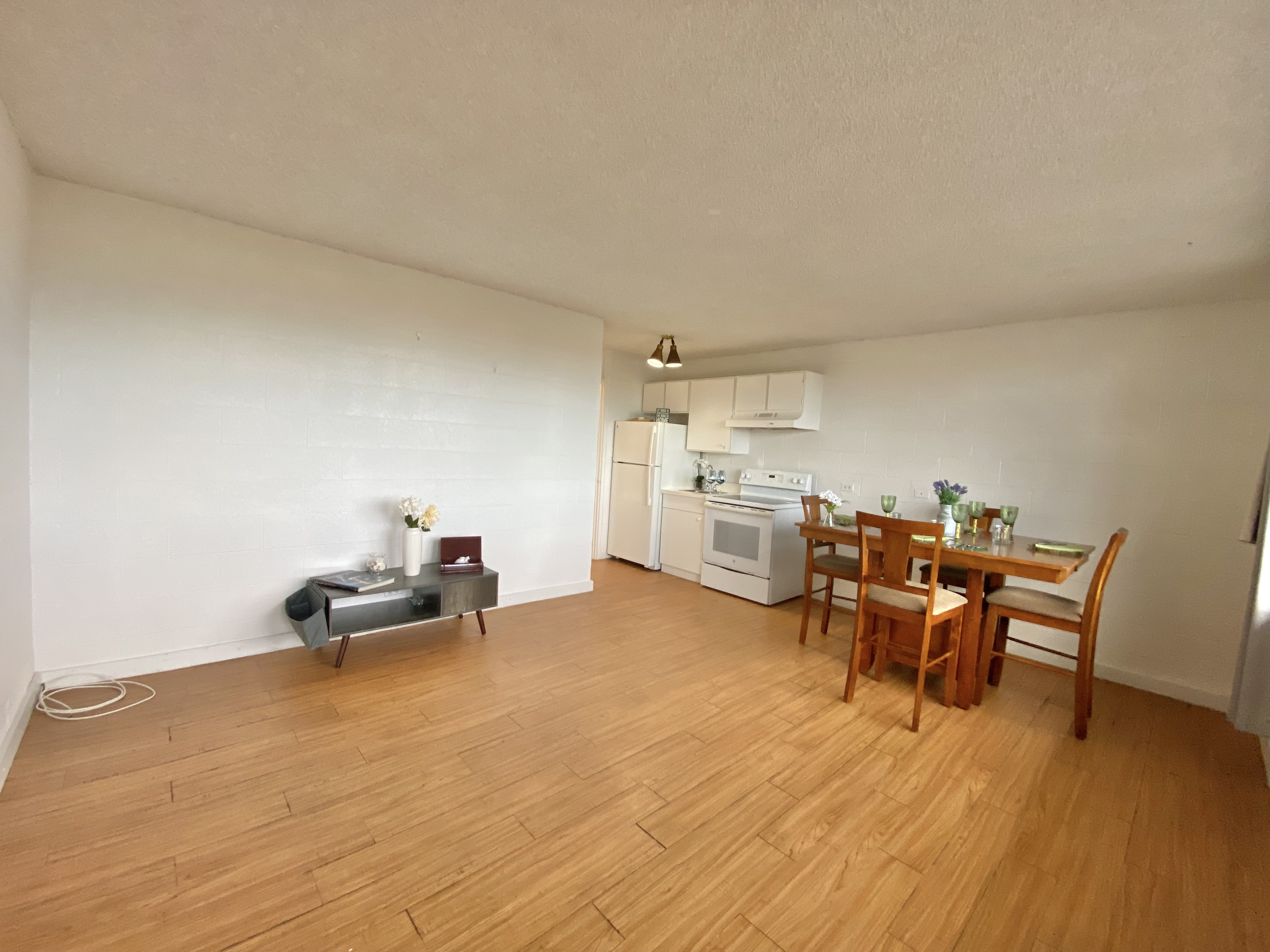 270 Ululani Street, Unit 27 Hilo, HI 96720 - Photo 2 of 19 a living room with furniture and a wooden floor