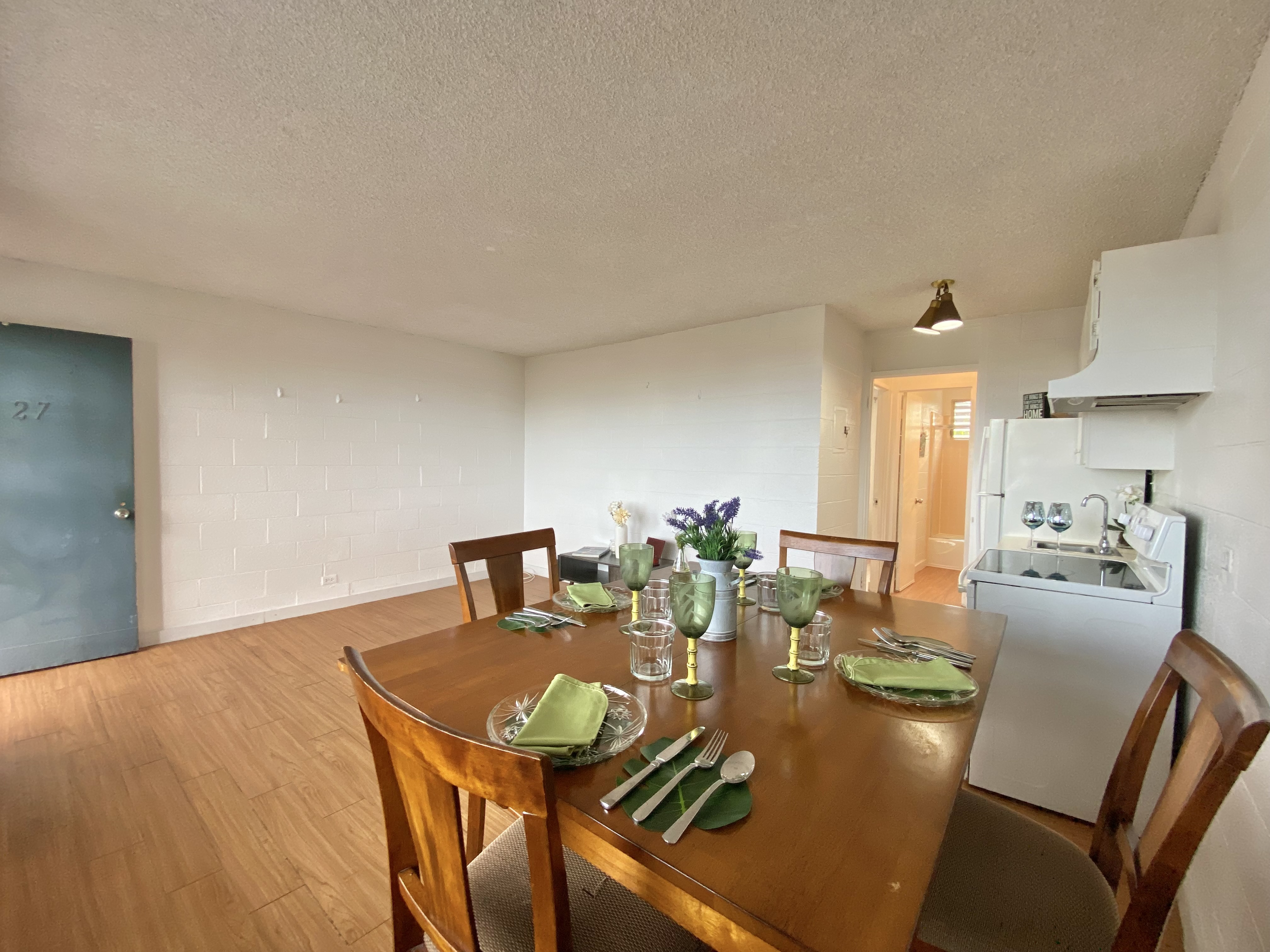 270 Ululani Street, Unit 27 Hilo, HI 96720 - Photo 4 of 19 a view of a dining room with furniture and wooden floor