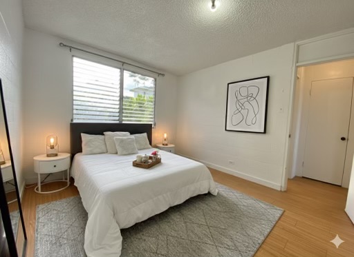 270 Ululani Street, Unit 27 Hilo, HI 96720 - Photo 10 of 19 a bedroom with a bed and a window