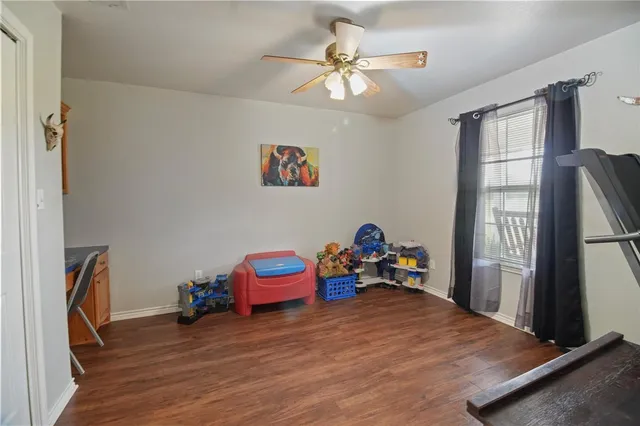 a view of a room with toys and a window