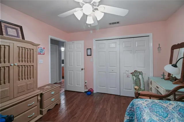 a view of a livingroom with furniture and hallway