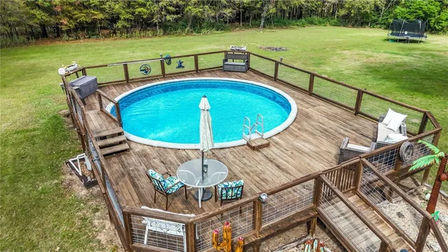 a view of a swimming pool with a patio