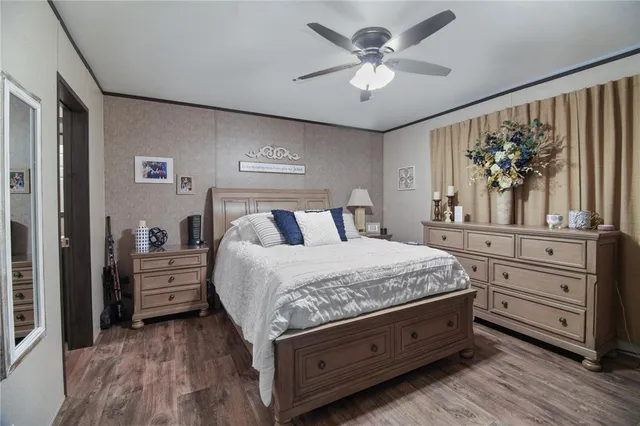 a spacious bathroom with a toilet a sink and mirror