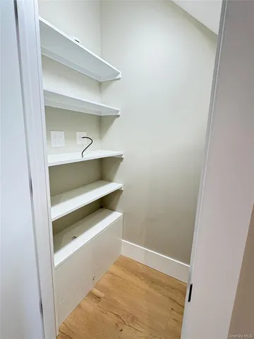 a view of an empty walk in closet