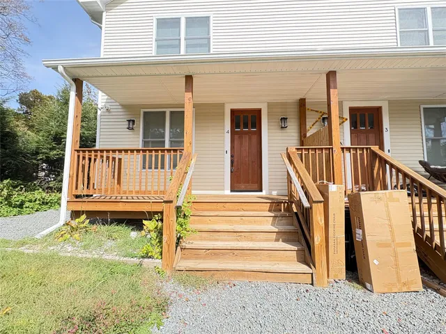 a front view of a house with a porch