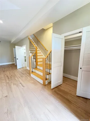 a view of an entryway with wooden floor