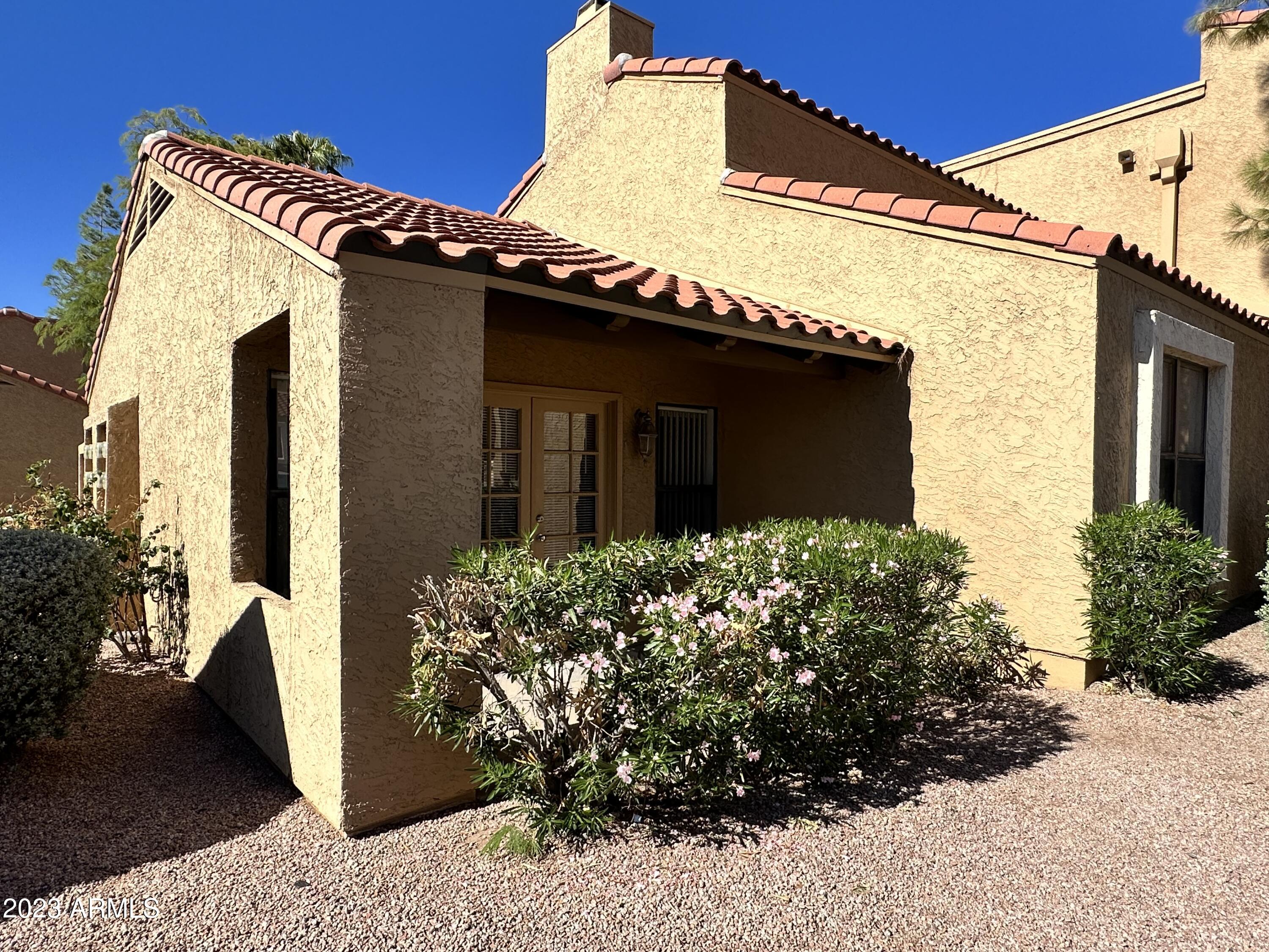 8787 East Mountain View Road, Unit 1103 Scottsdale, AZ 85258 - Photo 25 of 38 a view of a front of house with a yard