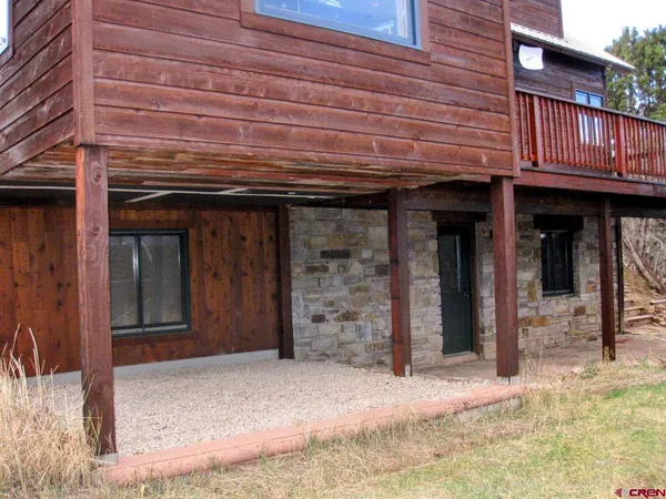 a view of balcony with wooden floor