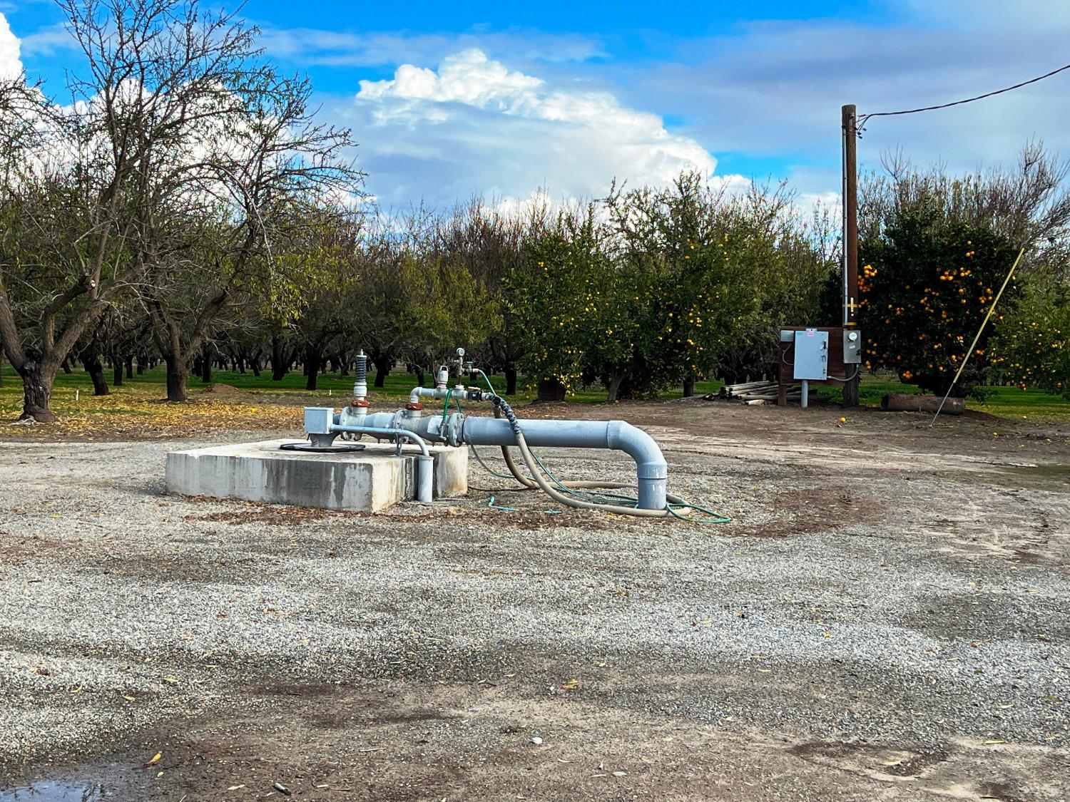 0 Eucalyptus Avenue Winton, CA 95388 - Photo 7 of 12 a white house with a yard and sitting area