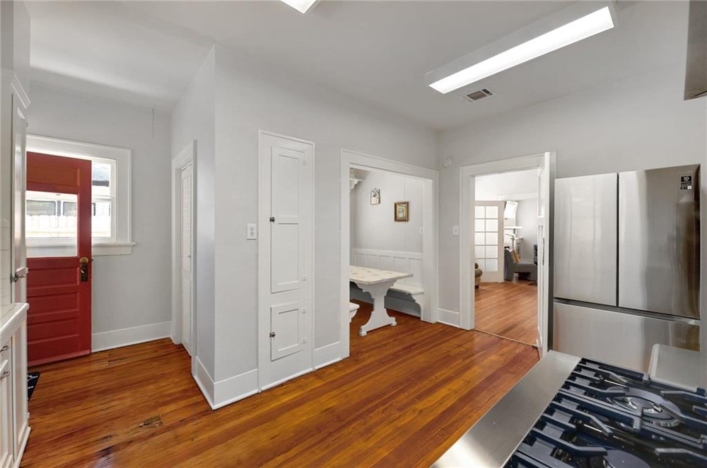 1604 South Main Street Georgetown, TX 78626 - Photo 14 of 25 a kitchen with a refrigerator and a stove top oven