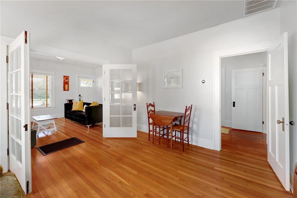 1604 South Main Street Georgetown, TX 78626 - Photo 16 of 25 a living room with furniture and a wooden floor
