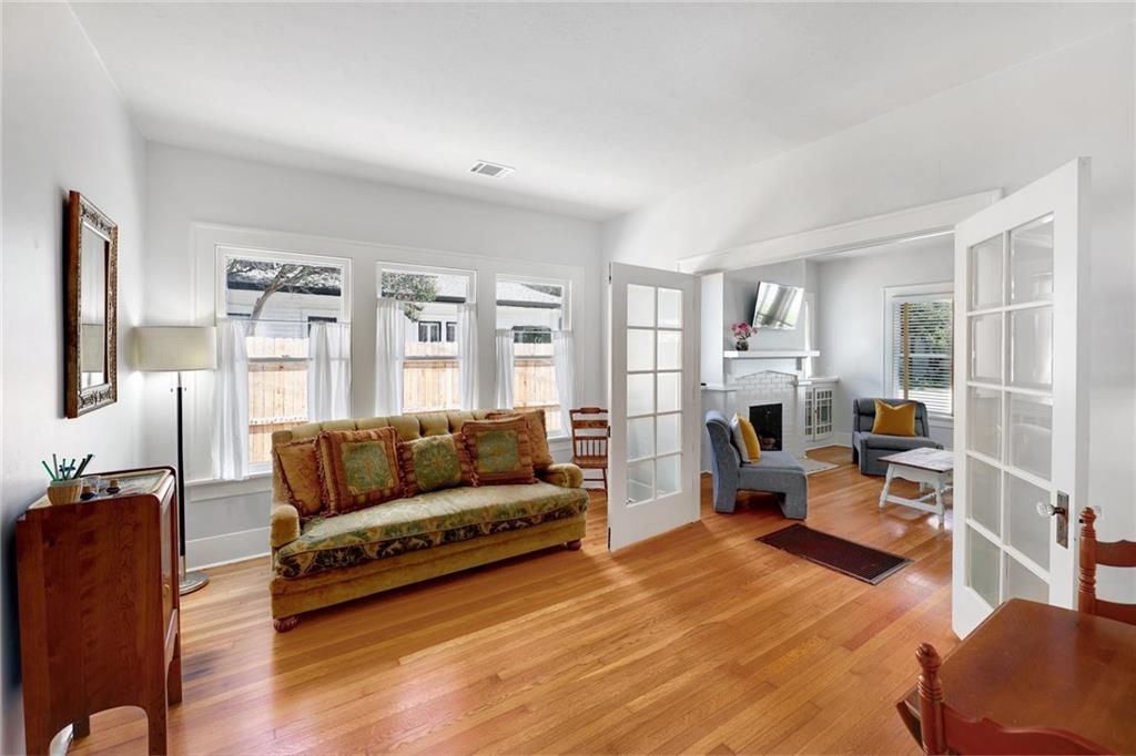 1604 South Main Street Georgetown, TX 78626 - Photo 18 of 25 a living room with furniture and a wooden floor